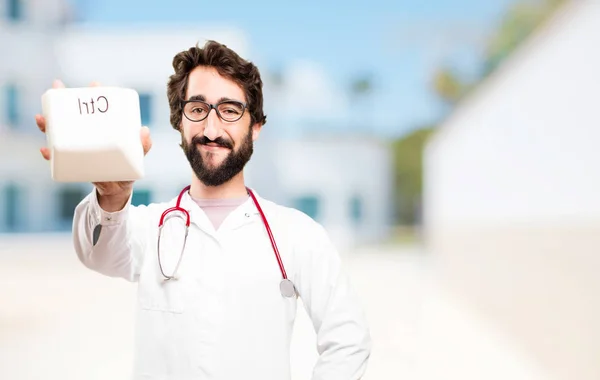 Young doctor man with a control key — Stock Photo, Image