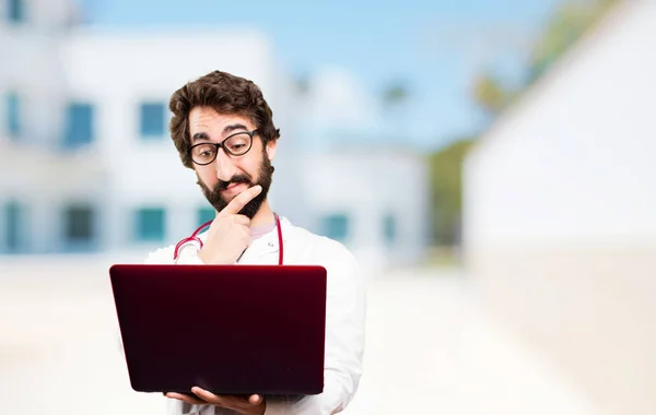 Young doctor man with a laptop — Stock Photo, Image