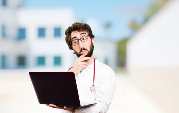 Young doctor man with a laptop — Stock Photo, Image