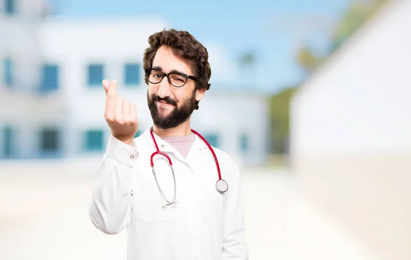 Genç doktor adam para işareti ile — Stok fotoğraf