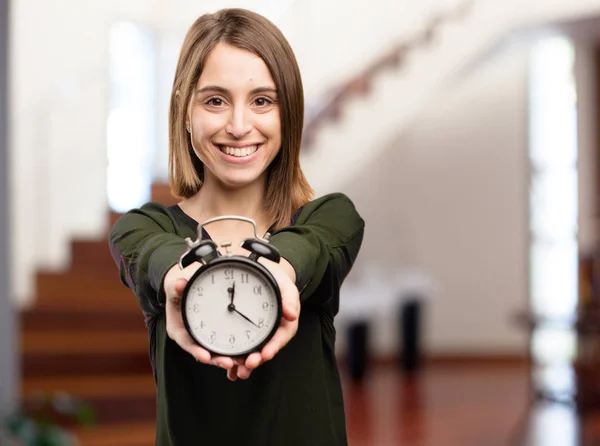 Young pretty woman with clock — Φωτογραφία Αρχείου