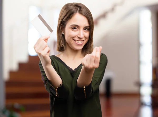 Young pretty woman with credit card — Stock Photo, Image