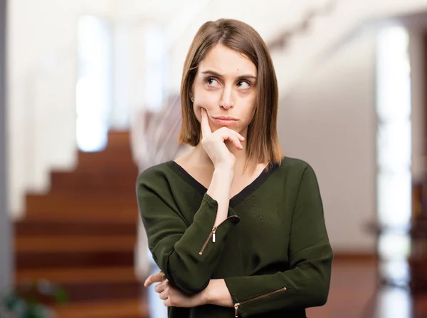 Angry young pretty woman thinking — Stock Photo, Image