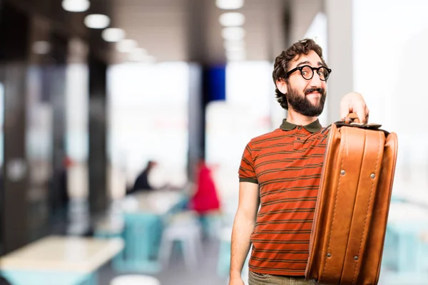 Junger cooler Mann mit einem Koffer — Stockfoto