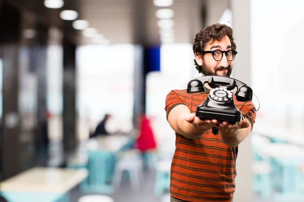 Young cool man with a vintage phone — Stock Photo, Image
