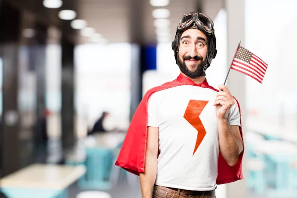 Joven super héroe con una bandera — Foto de Stock