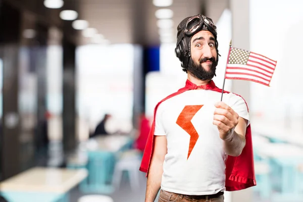 Joven super héroe con una bandera — Foto de Stock