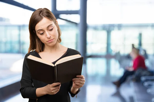 Young pretty woman with a book — Stock Photo, Image