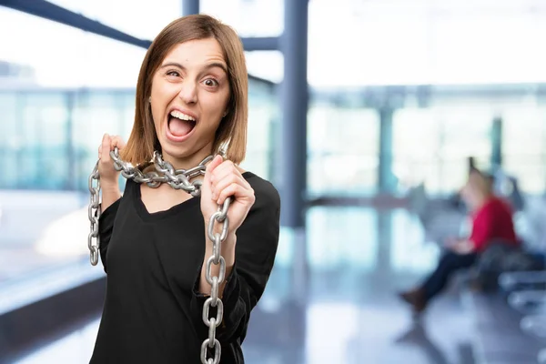 Angry young pretty woman with a chain — Stock Photo, Image