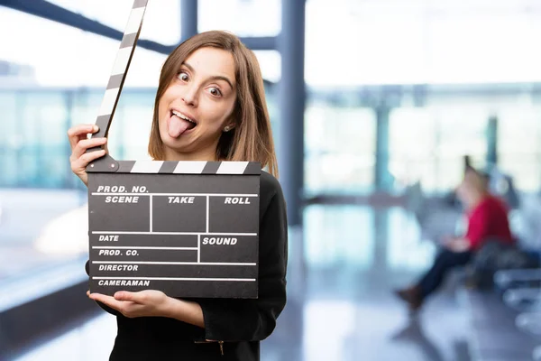 Young pretty woman with clapper — Stock Photo, Image