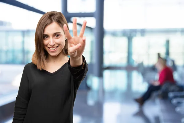 Giovane bella donna con il segno di numero — Foto Stock