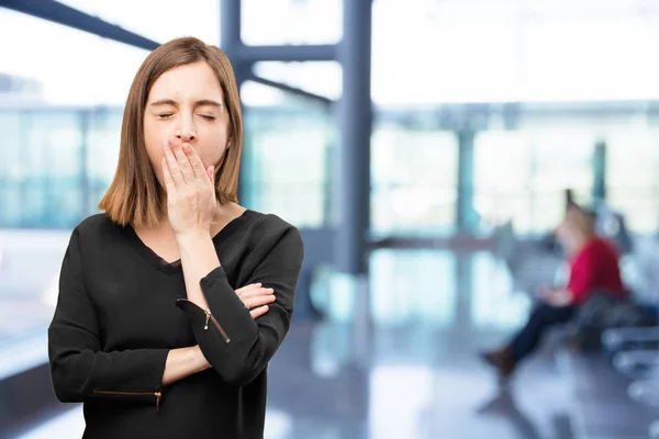 Sad young pretty woman yawning — Stock Photo, Image