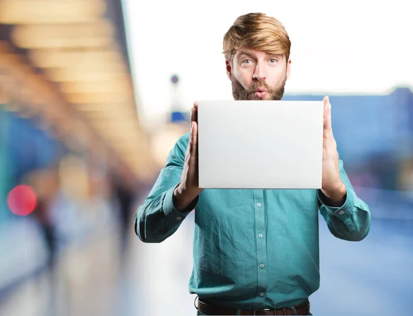 Young blonde man with a placard — Stock Photo, Image