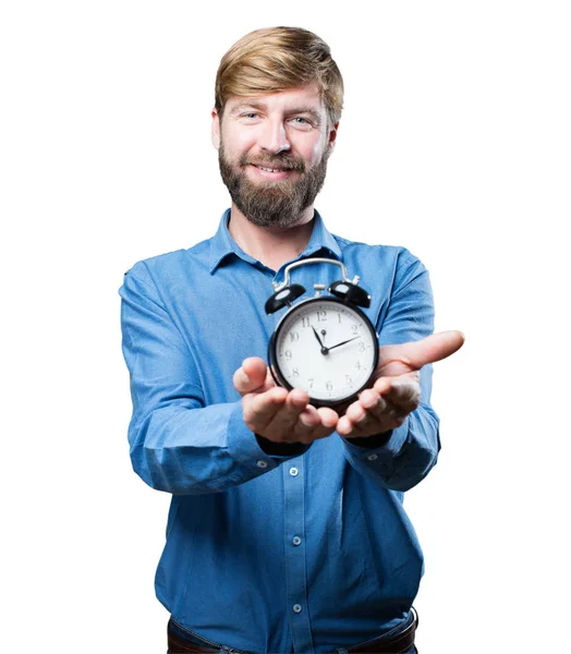Jeune homme blond avec une horloge — Photo