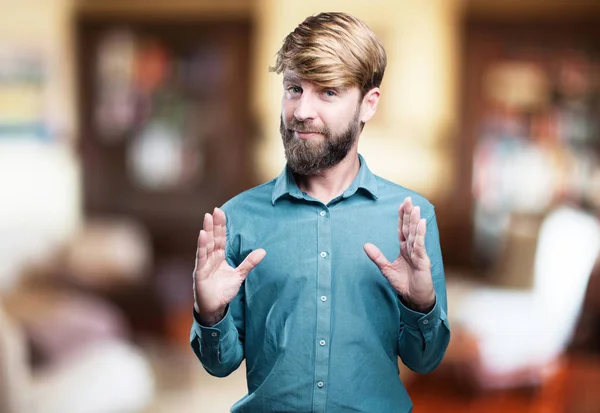 Young blonde man in showing pose — Stock Photo, Image