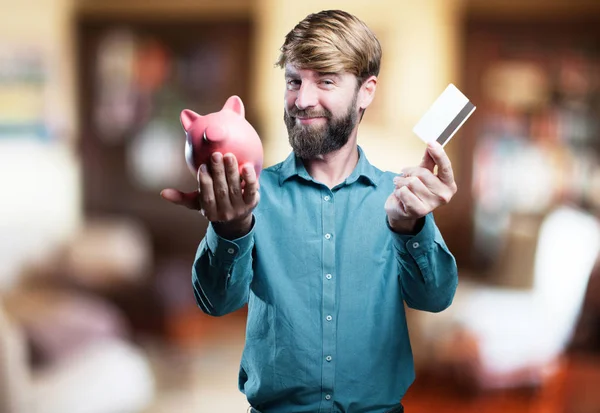 Muž s kreditní karta a prasátko — Stock fotografie