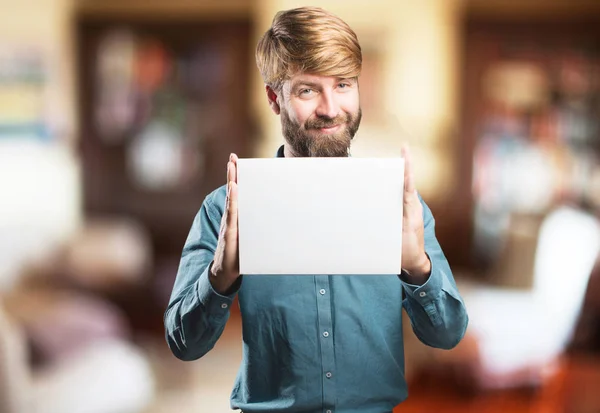 Young blonde man with a placard — Stock Photo, Image