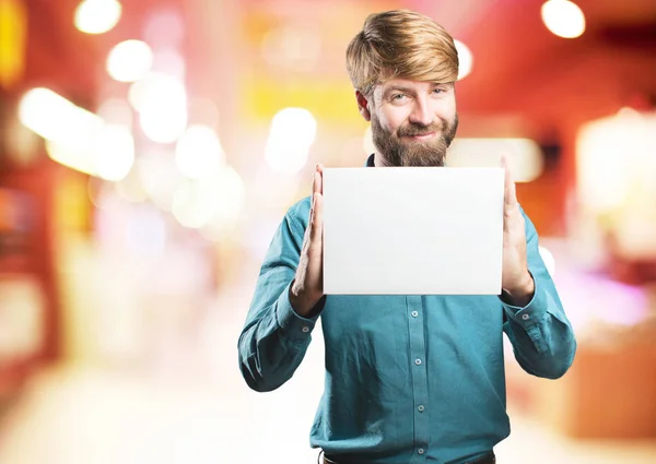 Young blonde man with a placard — Stock Photo, Image