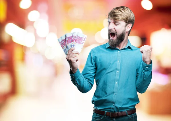 Young blonde man with bills — Stock Photo, Image