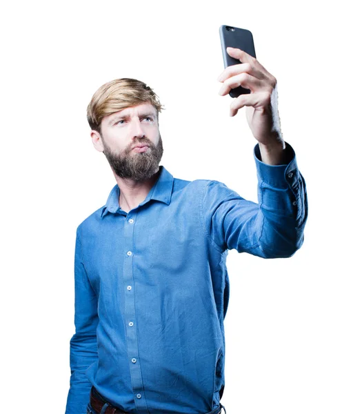 Młody człowiek blondynka z telefonu komórkowego — Zdjęcie stockowe