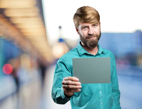 Young blonde man with a gray card — Stock Photo, Image