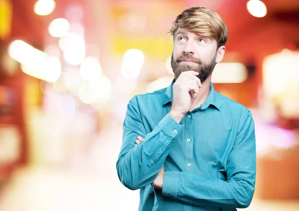 Young blonde man thinking — Stock Photo, Image