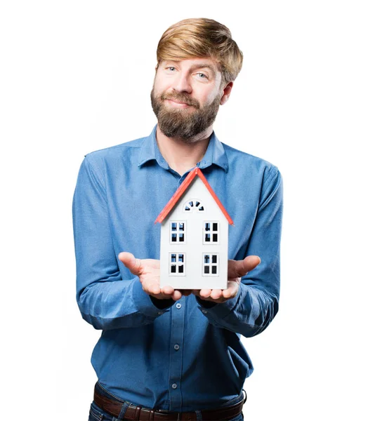 Young blonde man with a house — Stock Photo, Image