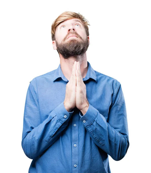 Jonge blonde man bidden — Stockfoto