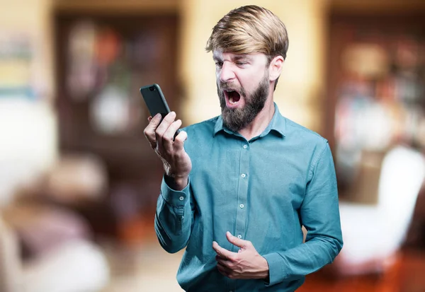 Young blonde man with mobile phone — Stock Photo, Image