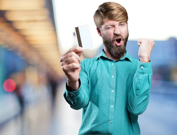 Joven hombre rubio con tarjeta de crédito —  Fotos de Stock