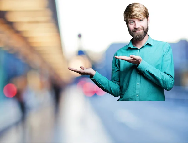 Young blonde man in showing pose — Stock Photo, Image