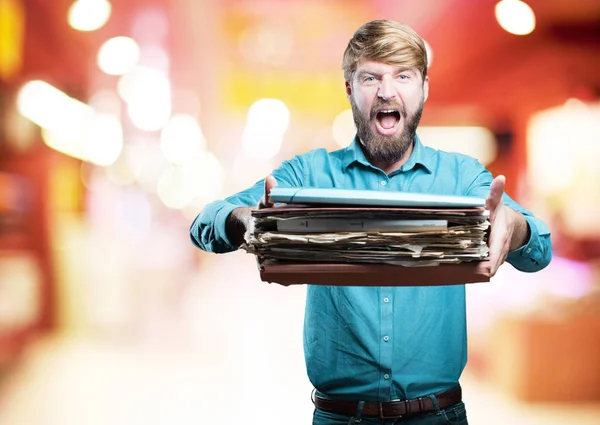 Young blonde man shouting with documents — Stock Photo, Image