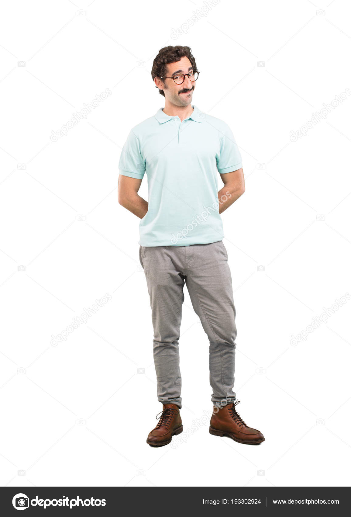 Portrait Of Smart Casual Man Wearing Glasses, Posing In White Studio  Background With Hands And Legs Crossed Stock Photo, Picture and Royalty  Free Image. Image 54205230.