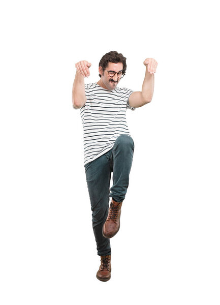 Young crazy man with angry expression. Full body cutout person against white background.