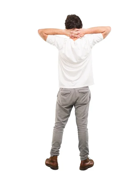 Young crazy man with satisfied expression and pose. Full body cutout person against white background.