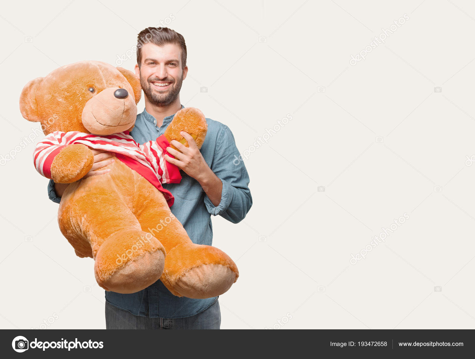 holding a teddy bear