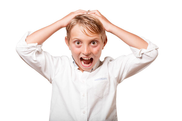 young blonde boy in crazy pose over white background