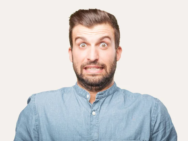 Jonge Knappe Man Met Verrast Geschokt Expressie Een Blauwe Shirt — Stockfoto