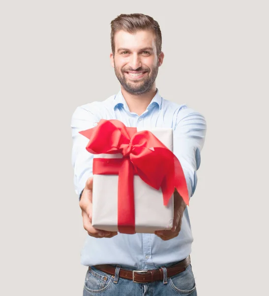 Young Handsome Man Gift Box Surprised Expression Wearing Blue Shirt — Stock Photo, Image