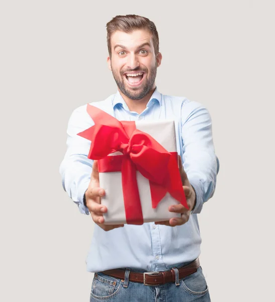 Young Handsome Man Gift Box Surprised Expression Wearing Blue Shirt — Stock Photo, Image