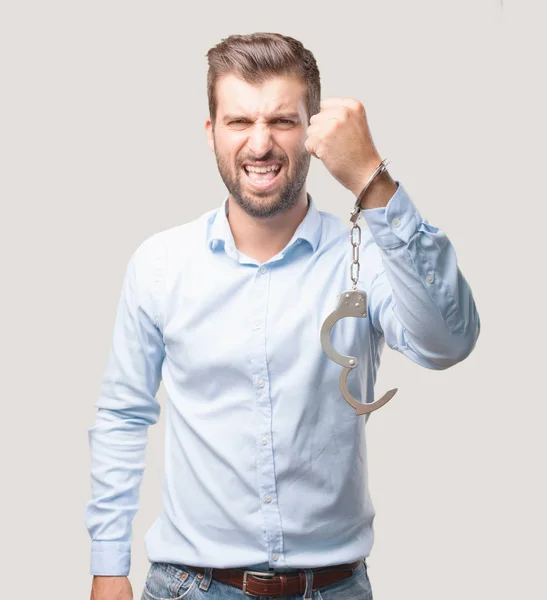 Young Handsome Man Handcuffs Celebrating His Triumph Wearing Blue Shirt — Stock Photo, Image