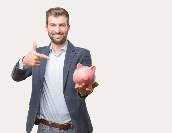 Jovem Empresário Bonito Blazer Azul Segurando Banco Porquinho Feliz Comemorando — Fotografia de Stock