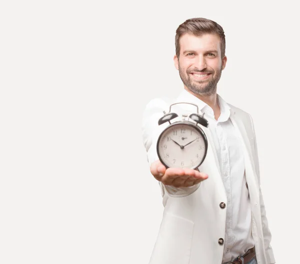 Jovem Empresário Bonito Segurando Despertador Blazer Branco Expressão Satisfeita Feliz — Fotografia de Stock