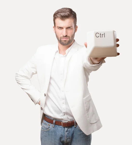 Young Handsome Businessman Holding Control Key Keyboard Wearing White Blazer — Stock Photo, Image