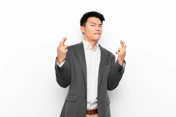 Young Chinese Man Crossing Fingers Anxiously Hoping Good Luck Worried — 图库照片