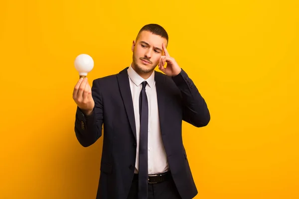 Young Handsome Businessman Flat Background Light Bulb — Stock Photo, Image