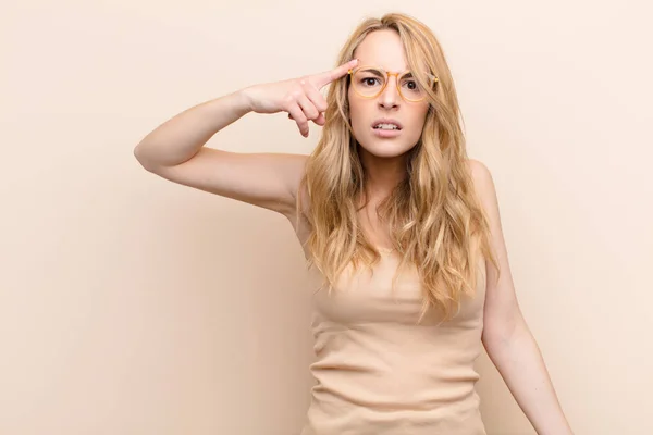 Young Pretty Blonde Woman Feeling Confused Puzzled Showing You Insane — Stock Photo, Image