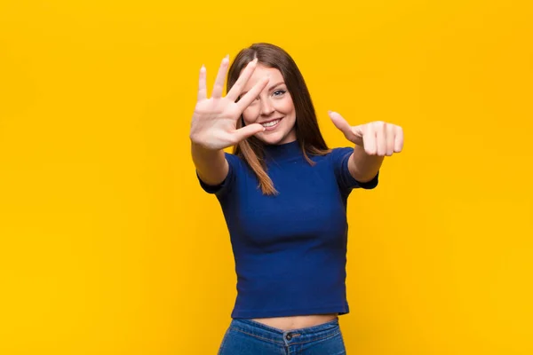 Young Red Head Woman Smiling Looking Friendly Showing Number Six — Stock Photo, Image