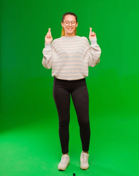 Young Pretty Latin Woman Smiling Anxiously Crossing Both Fingers Feeling — Stock Photo, Image