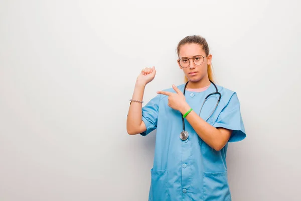 Young Latin Nurse Looking Impatient Angry Pointing Watch Asking Punctuality — ストック写真